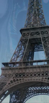 This live wallpaper features a stunning view of the eiffel tower from below, covered in a transparent cloth