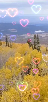 This live wallpaper presents a lovely scene with hearts in the air against an aspen grove background