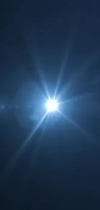 This live wallpaper features a stunning dark blue sky with the sun shining brightly, creating a sense of light and space