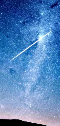 This live wallpaper features a plane flying through a night sky filled with shooting stars, a shining meteor, and a bright blue fireball