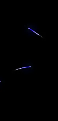 This dynamic live wallpaper features two planes soaring through the night sky, surrounded by a dark and starry backdrop with subtle hints of purple and blue hues