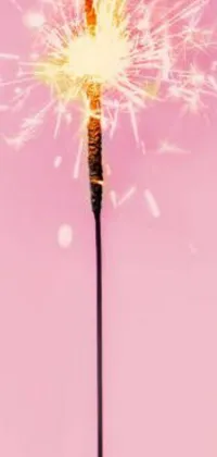 This captivating phone live wallpaper features a stunning illustration of a sparkler on a stick, captured in beautiful magic realism style