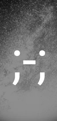 This phone live wallpaper features a black and white image of a smiley face with exaggerated features inspired by Taiyō Matsumoto
