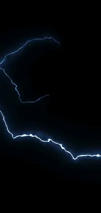 This phone live wallpaper depicts a skateboarder riding on a dark background while lightning strikes in vivid blue indigo