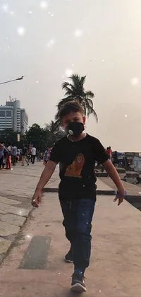 Experience the future of Mumbai with this unique live wallpaper! Watch as a young boy effortlessly rides his skateboard down a sidewalk, performing impressive tricks with ease