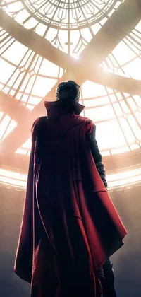 This phone live wallpaper showcases a man draped in a red cloak, staring out at the vast expanse of space beyond a large window