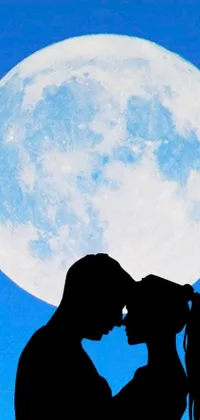 This phone live wallpaper depicts a passionate silhouette of a couple kissing in front of a full moon