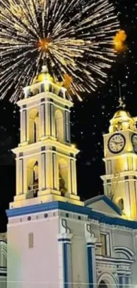 Enhance your phone's background with this dazzling live wallpaper featuring a stunning clock tower building surrounded by exploding fireworks