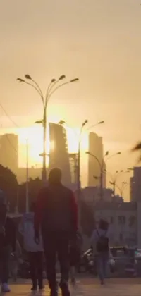 This live wallpaper showcases a dynamic group of skateboarders zooming down a sunset-lit city sidewalk