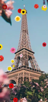 Adorn your mobile screen with this trendy and elegant live wallpaper featuring an exterior shot of the iconic Eiffel Tower surrounded by a lovely array of pink flowers