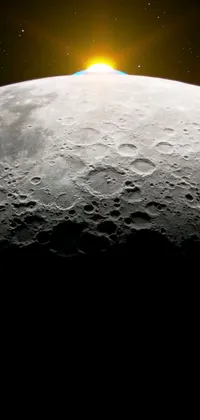 This phone live wallpaper features a captivating close-up of the moon with the sun shining in the background