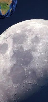This phone live wallpaper depicts a captivating close-up of the moon with earth in the background