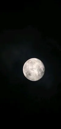 This live wallpaper features a stunning full moon against a dark sky background