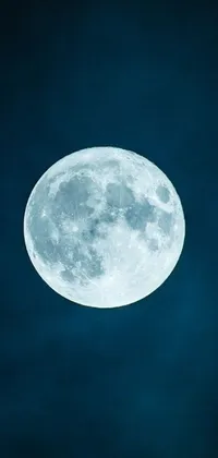 This live wallpaper for your phone showcases a bright shining moon surrounded by twinkling stars on a dark blue background