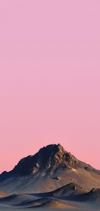 This phone live wallpaper features a post-minimalistic design of a large mountain in a desert landscape