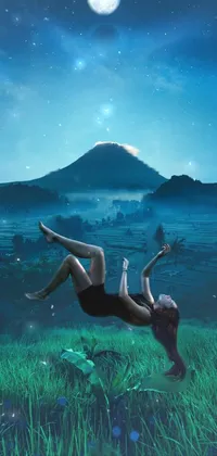 This stunning live wallpaper depicts a surreal scene of a woman floating in a lush green field beside Mt