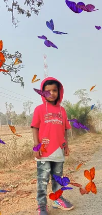 This phone live wallpaper features an animated illustration of a young boy skateboarding down a dirt path, accompanied by a Sukhothai costume and a red hoodie
