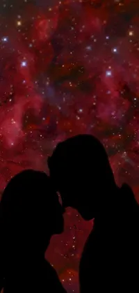 This live phone wallpaper showcases an intimate couple standing against a star-tiled sky