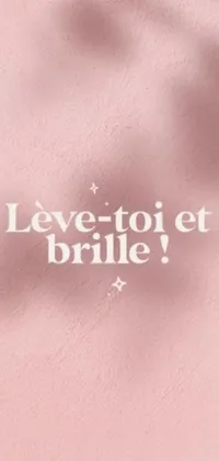 This stunning live wallpaper for your phone features a vibrant pink wall with the phrase "Love to e brille" in cursive script