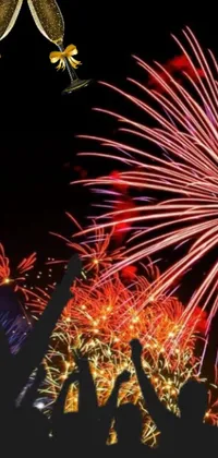 This stunning live phone wallpaper displays a group of people in front of a spectacular fireworks display