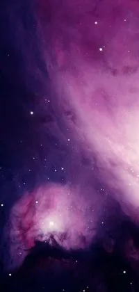 Looking for a stunning phone wallpaper that will transport you to a purple nebula full of stars? Look no further than this live wallpaper! With its dreamy and celestial aesthetic, this design is perfect for anyone who loves to stargaze