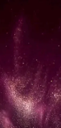 This live phone wallpaper features a beautiful night sky filled with twinkling stars, paired with a unique microscopic photo, dynamic video art, maroon mist, sparkling glitter gif, and a subtle perfume effect
