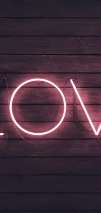 Infuse your phone with a tranquil touch of romance with this mesmerizing live wallpaper! A neon "love" sign glows against a wooden wall, imparting a gentle message into your device's home screen