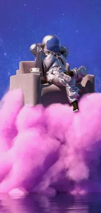 Experience the stunning beauty of this live wallpaper, showcasing an astronaut sitting in a chair amidst a captivating cloud of pink smoke
