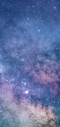 This live wallpaper features a stunning night sky filled with a multitude of stars in shades of blue and purple