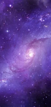 Transform your phone's home screen with a stunning live wallpaper that captures the beauty of a glowing purple galaxy with spiral arms and twinkling stars
