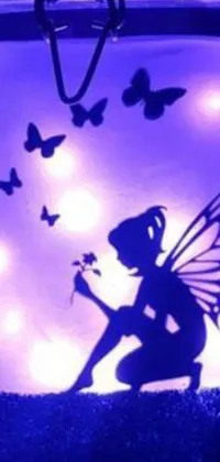 This stunning live wallpaper features a charming fairy perched inside a glass jar, surrounded by a bright purple room