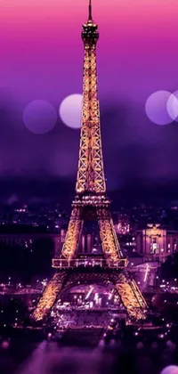 This mobile live wallpaper showcases the beautiful Eiffel Tower illuminated at night in a stunning digital art picture