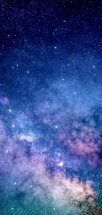 Transform your smartphone display with this stunning live wallpaper featuring a breathtaking night sky filled with shimmering stars and a captivating galaxy formation