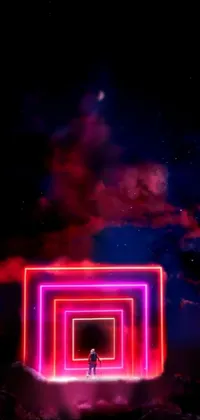 This stunning phone live wallpaper features a man standing in the center of a bold and vibrant pink and red colored universe, surrounded by a modern tunnel