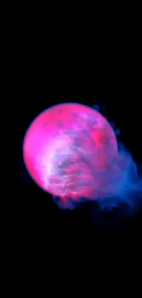 This live phone wallpaper features a captivating pink object with fluid smoke