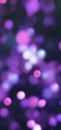 This phone live wallpaper showcases a stunning image of blurred purple flowers with added digital art elements such as iridescent glowing chips and multicolored dots