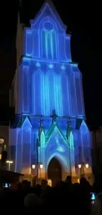 Get ready to be amazed by this phone live wallpaper! A grand alabaster gothic cathedral serves as the backdrop for a mesmerizing holographic display