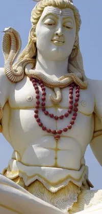 This live wallpaper features an intricately detailed statue of a man with a snake around his neck, complemented by white biomechanical elements