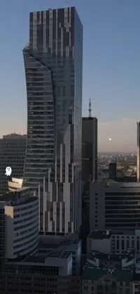 This phone live wallpaper showcases a panoramic view of Warsaw from a scenic high-rise building