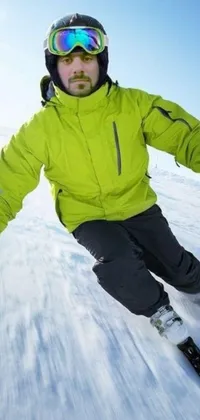 Bring the adrenaline-inducing thrill of skiing right to your phone with this live wallpaper! You'll watch as an athletic figure, clad in a green bomber jacket and tracksuit, expertly navigates down a snow-covered slope
