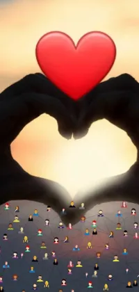 This phone live wallpaper presents an endearing image of someone forming a heart shape with their hands