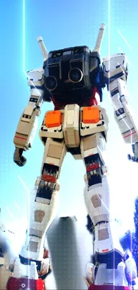Looking for a jaw-dropping live wallpaper for your phone? Check out this stunning image of a massive white and red robot statue, resembling the popular Extreme Gundam mecha