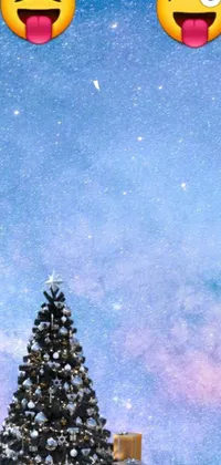 This live phone wallpaper features a stunning depiction of a Christmas tree with playful emoticons floating above it