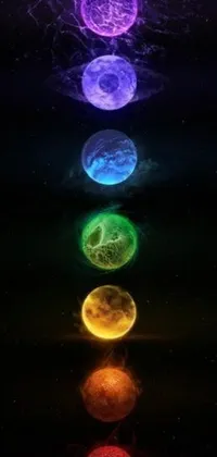 This mesmerizing live wallpaper features a celestial theme with multi-colored glowing moons, rotating planets and cosmic energy pulsating from the center