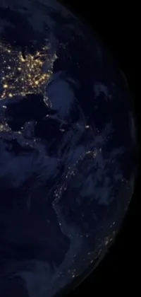 This phone live wallpaper features a breathtaking satellite view of the earth at night, showcasing its vibrant urban centers and serene water bodies