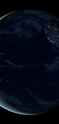 This stunning live wallpaper captures the beauty of Earth as seen from space at night, with vibrant cities and towns glowing bright against a dark background