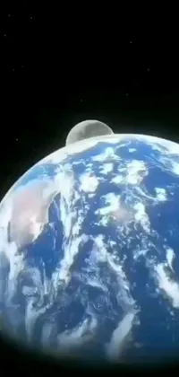 This live phone wallpaper displays a stunning view of Earth from space with a backdrop of the Moon