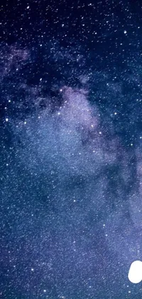 Immerse yourself in the mesmerizing beauty of the night sky with this stunning live wallpaper