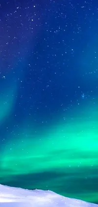 This phone live wallpaper features a mesmerising digital art image of a couple on a snowy slope