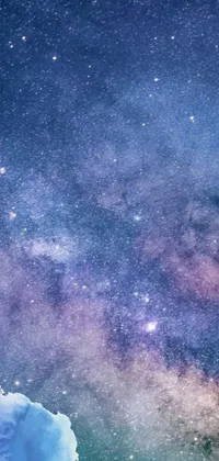 This live wallpaper for phones features a stunning night sky filled with bright stars and puffy clouds